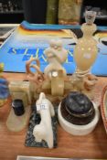 A selection of stone carved and hand worked figures and book ends including lamp base