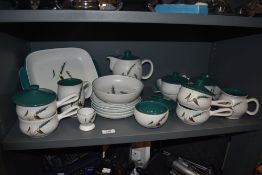 A collection of mid century table and dinner wares by Denby in the Green wheat design