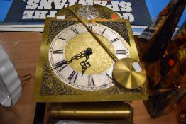 A long case clock face and weight set marked Tempus Fugit
