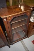 A 19th Century walnut music sheet music cabinet having glass front