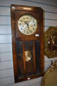 An early 20th century oak cased wall clock, From the estate of the late Cedric Robinson, Guide