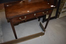 A Victorian mahogany fold over tea table
