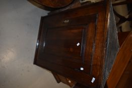 A period oak corner cupboard