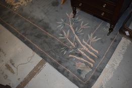A Chinese carpet square, in jade ground, approx. 264 x 186cm