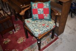 A 19th Century carved oak elbow chair