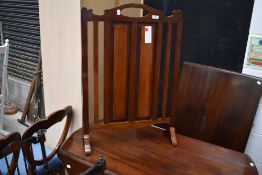 An early 20th Century mahogany fire screen