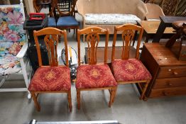Three modern pine dining chairs with shield style backs
