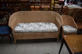 A two seat woven fibre sofa by Lloyd Loom and a similar tub chair
