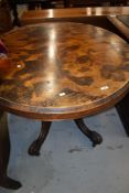 A Victorian walnut loo table on shaped legs