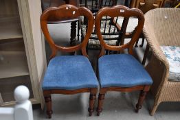A pair of Victorian mahogany balloon back dining chairs