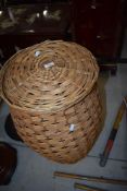 A wicker laundry basket
