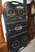 An air hockey table and accesories