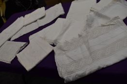 A mixed collection of intricate nightdress cases, pillow cases, bolster cases and huckaback towels.