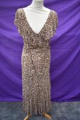 A 1930s Liberty of London crepe tea dress having brown floral design and ruffled collar, no