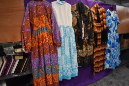 Five bright 1960s and 70s maxi dresses, vibrant patterns and designs.