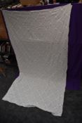 A late 19th early 20th century white bed throw having embroidered and cut work detailed sections.