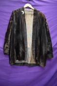 An unusual early 20th century velvet jacket, possibly oriental, some fade throughout.