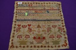 A Victorian sampler dated 1856, By Eliza Wrigglesworth, aged 10 with a variety of pictures including