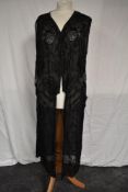 An extensively beaded 1920s tabbard dress having rose design, no full fastening present bar half