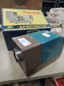 A portable Etude slide projector with case