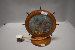 A mid century kitsch style sea side theme lamp having light up underwater scene