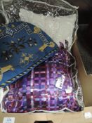 Two modern plush cushions and a beadwork tea cosy