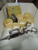 A selection of table wares including candle snuffer