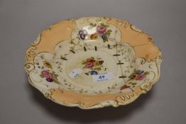 A 19th century porcelain comport, decorated with foliate sprays and scrolling gilt borders, with