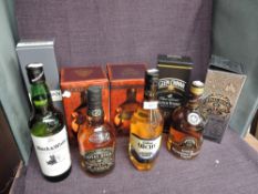 Nine bottles of Blended Scotch Whisky, Dimple De Luxe 12 Year Old x2, both in card boxes, Glen