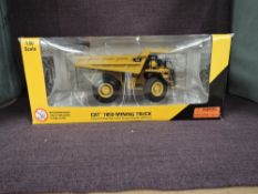 A Norscot 1:50 scale diecast, Cat 785D Mining Truck, in original window box 55216