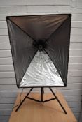 A small studio lighting system including lights, backdrop and tripod in soft carry case