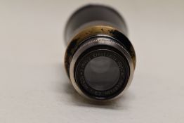 A Leica (Ernst Leitz Wetzlar) Elmar 'Mountain'105mm 1:6,3 lens No128799 in leather case