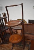 An early 20th Century mahogany folding cake stand