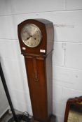 A 20th century grandmother clock having carved detailing to front and ornate beading.