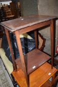 An Edwardian mahogany occasional table having line inlay decoration to slender tapered legs, width