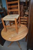 A Pine table and three chairs.