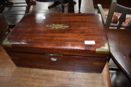 A Victorian writing slope having compartmental interior, brass brackets to corners, some wear.