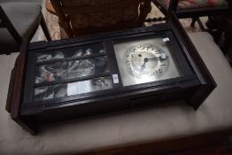 An early 20th Century oak cased wall clock