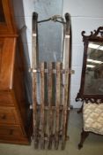 A vintage wooden toboggan/sledge