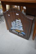 A dartboard in cupboard, livery for The Ships Inn