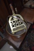 A traditional brass jam pan and trivet