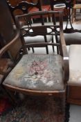 A Regency mahogany scroll armchair having fluted legs(af)