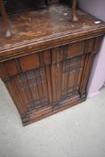 A Victorian sewing machine in cabinet