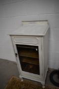 A late 19th/early 20th century painted mahogany sheet music cabinet.