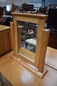 A modern golden oak dressing table mirror