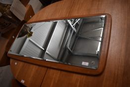 A vintage teak frame wall mirror