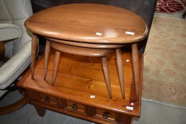 A nest of three Ercol tables, pebble style, mid colour