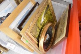 A selection of prints pictures and a wall clock