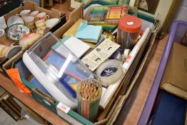 A selection of art supplies including pencils crayons etc