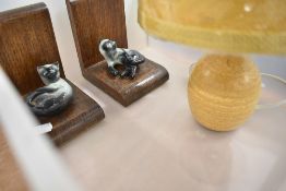 A modern Cumbrian studio pottery table lamp with mustard coloured shade, together with a pair of oak